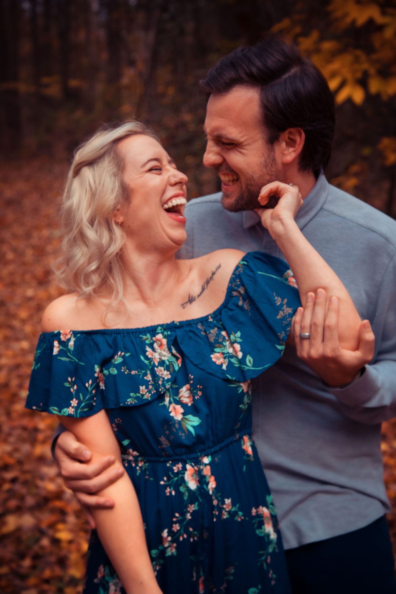 Couple laughing outdoors