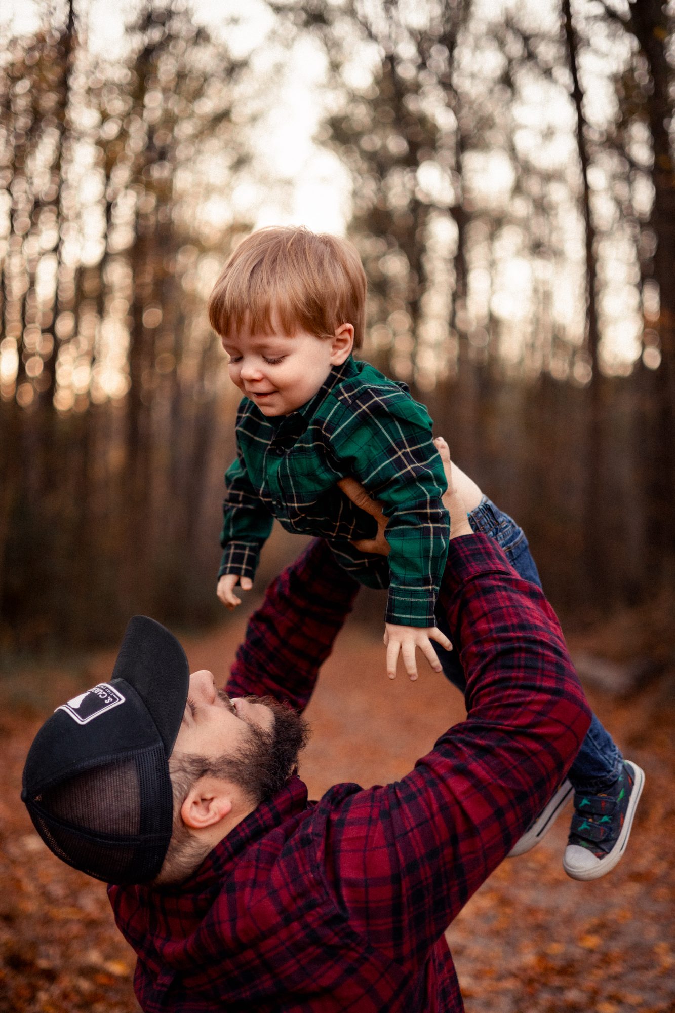 Father tossing son in the air