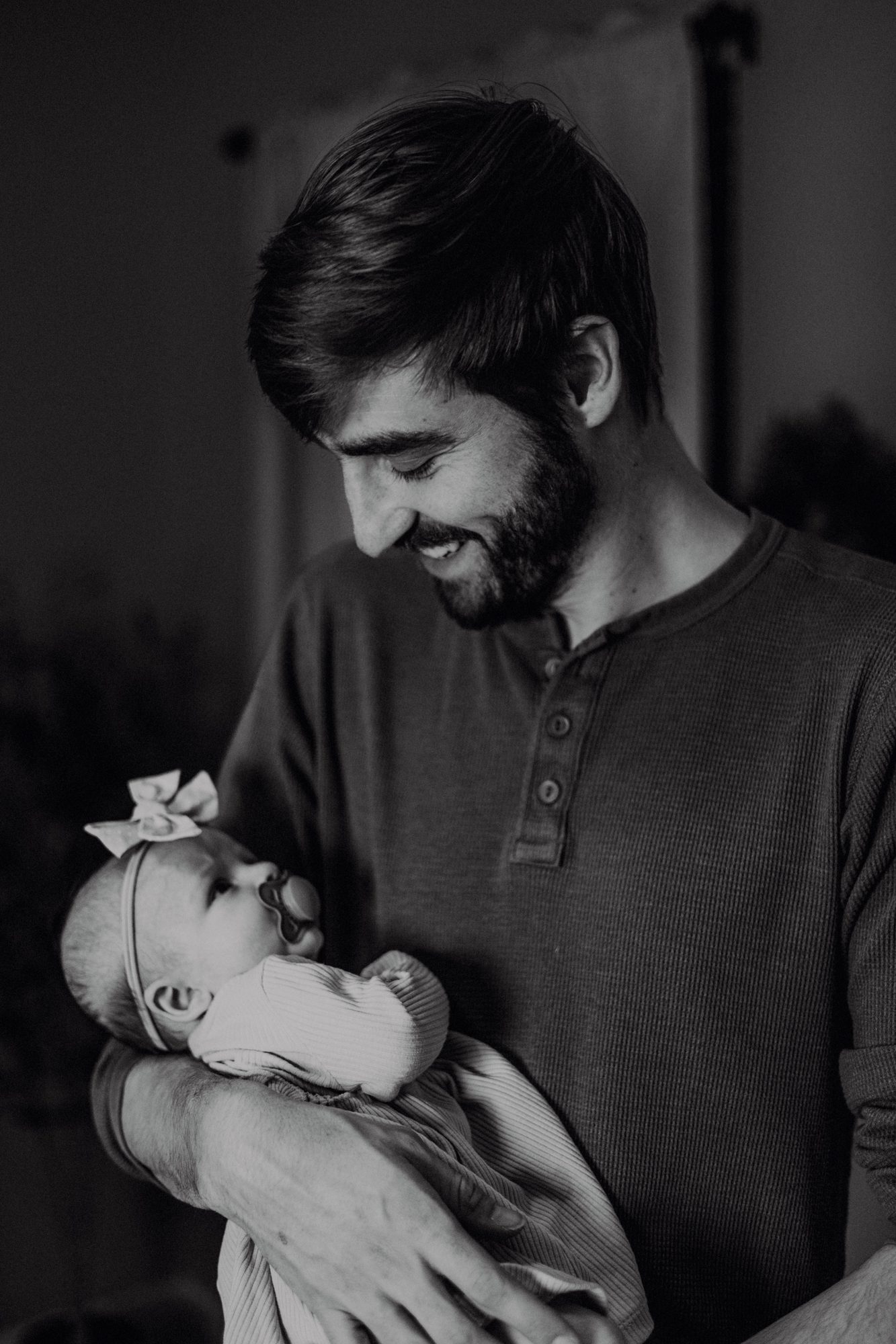 Father with newborn, black and white